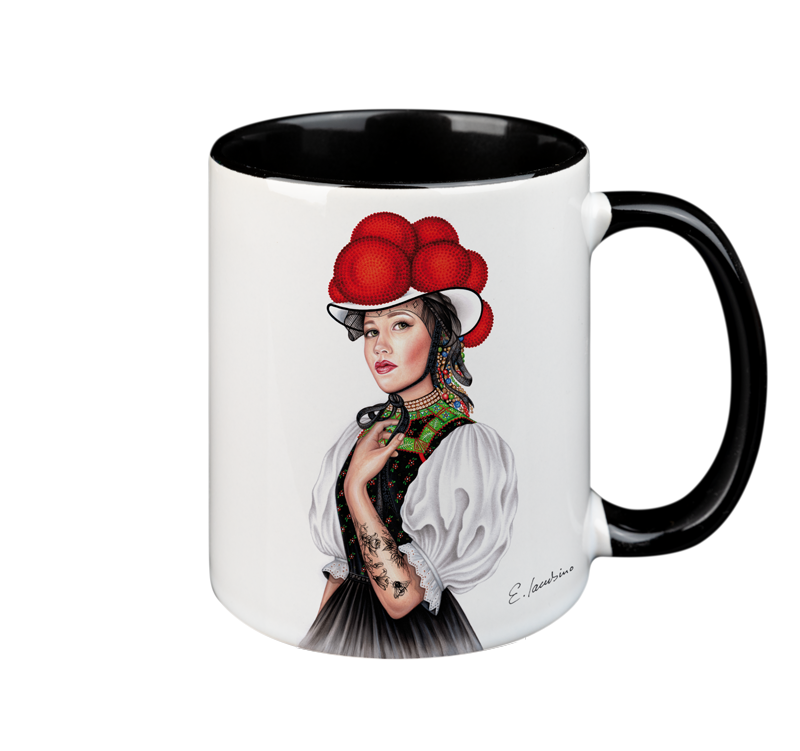 A white ceramic mug with a black handle and black interior features a detailed illustration of a woman wearing a traditional outfit and a red bollenhut hat. The woman has a thoughtful expression, and her attire is decorated with intricate patterns. This microwave-safe mug is also dishwasher safe. The product name is MUG – Bollenhut Black Forest Bonnie, by the brand Cuckoo's Nest.