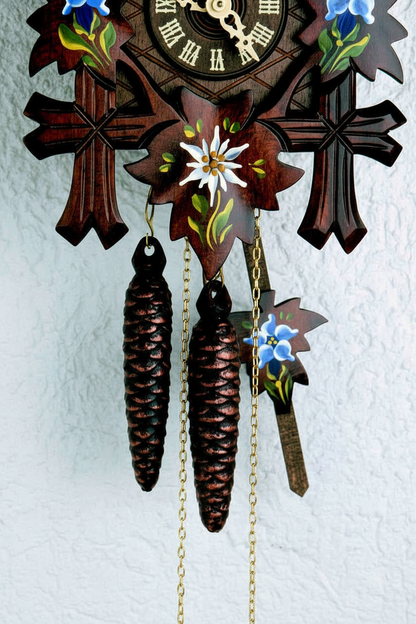 Black Forest Cuckoo Clock - Pinecone Weights Close-up